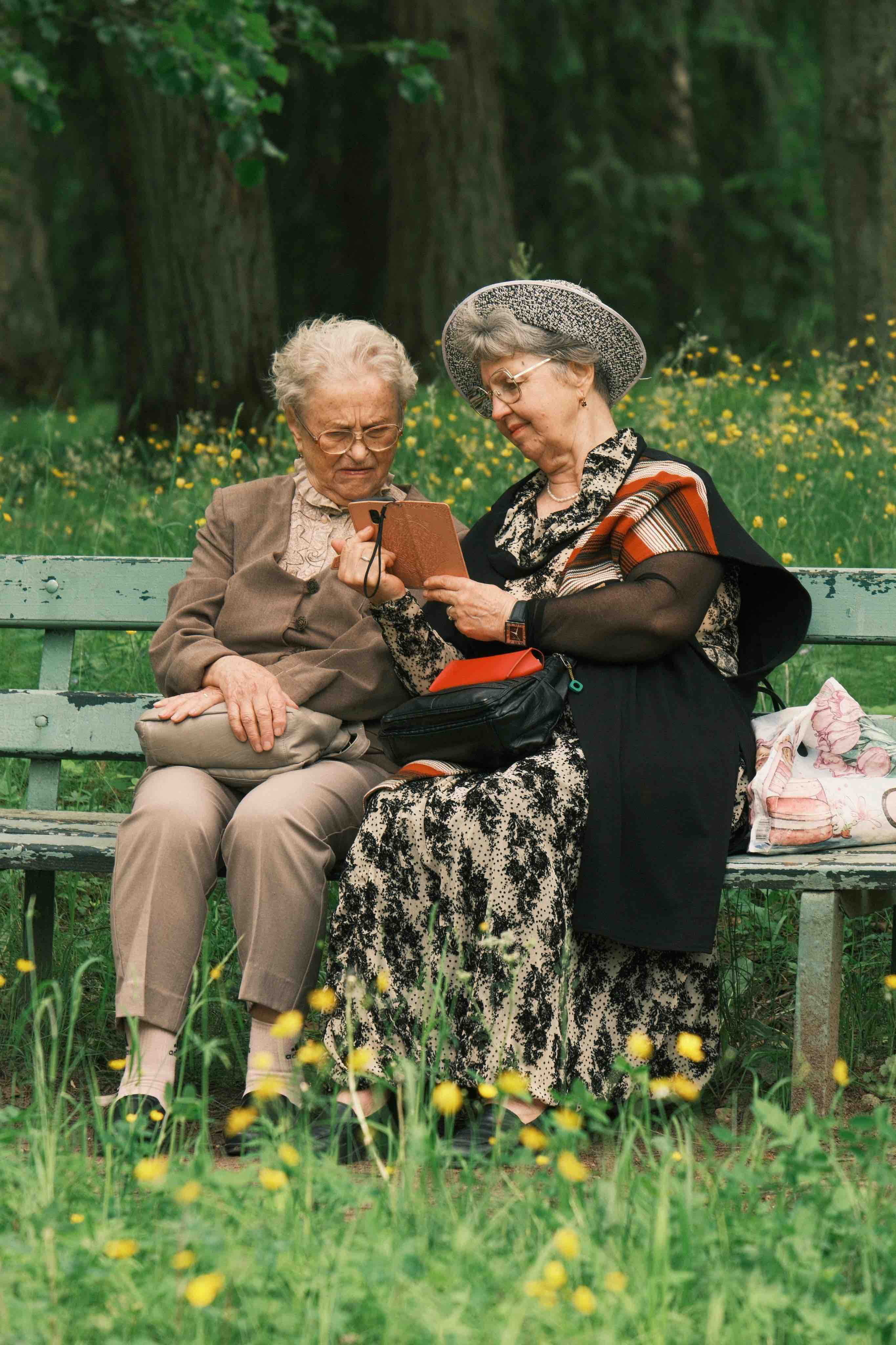 Two people sitting together outdoors